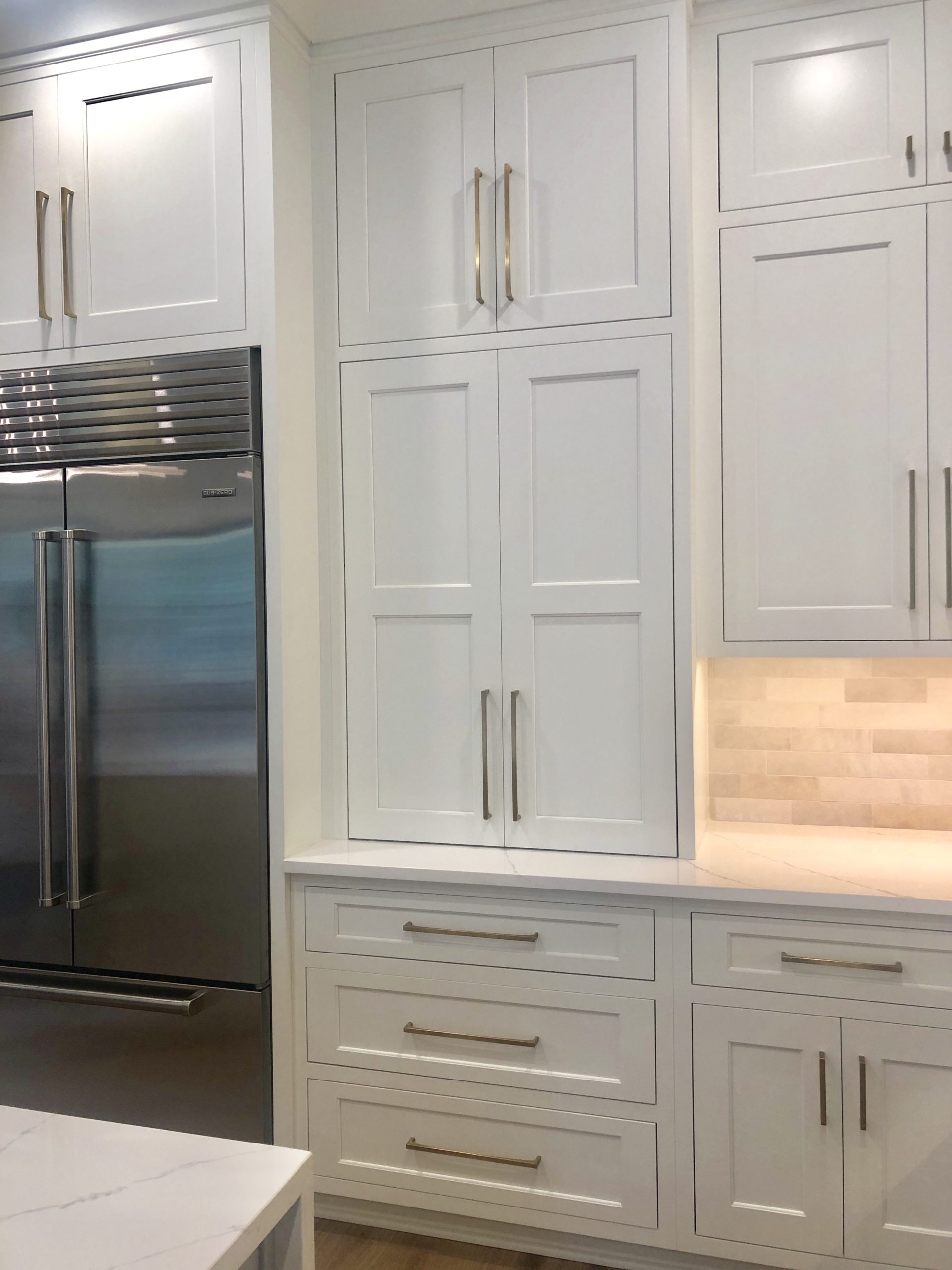 White Kitchen With Waterfall Island